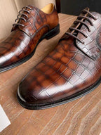 Two-tone Dior leather oxford shoes with dark brown and light gray crocodile pattern