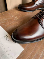 Dior unisex leather oxford shoes, dark brown with lace-up closure and polished toe