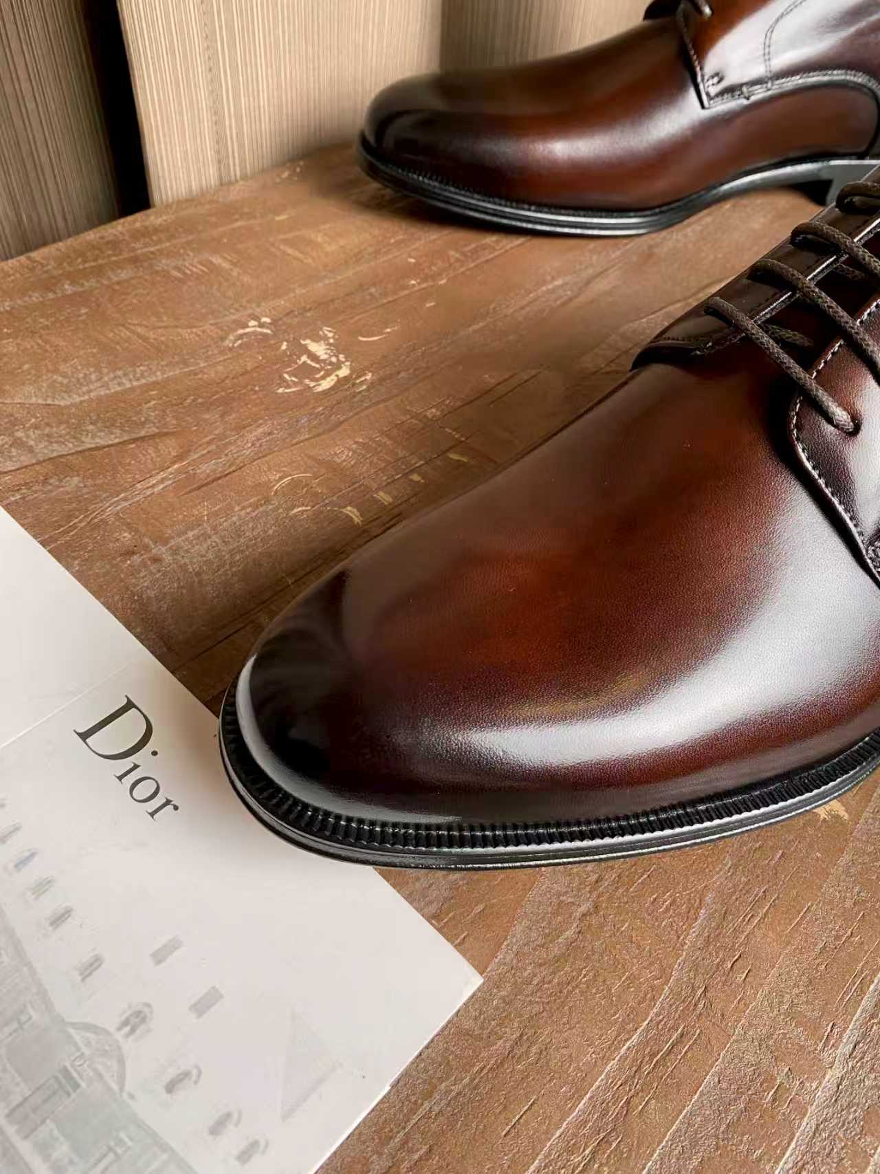 Dior unisex leather oxford shoes, dark brown with lace-up closure and polished toe
