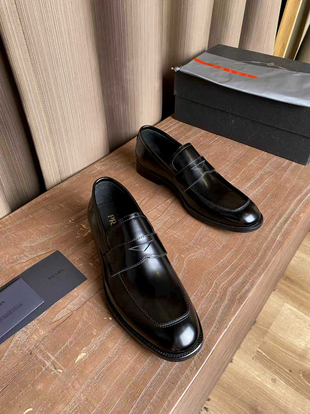 Prada unisex black leather loafers, slip-on design with stitching and low heel