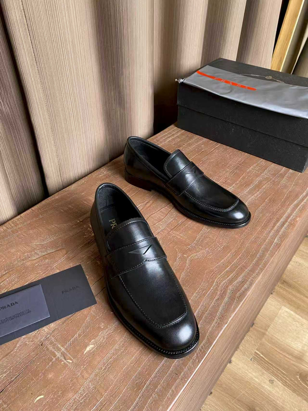 Prada unisex black leather loafers, closed toe slip-on with side stitching
