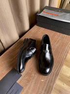 Prada unisex black leather loafers, low heel with slip-on upper and stitched panels