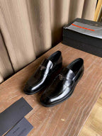 Prada unisex black leather loafers, rounded toe with stitched detailing