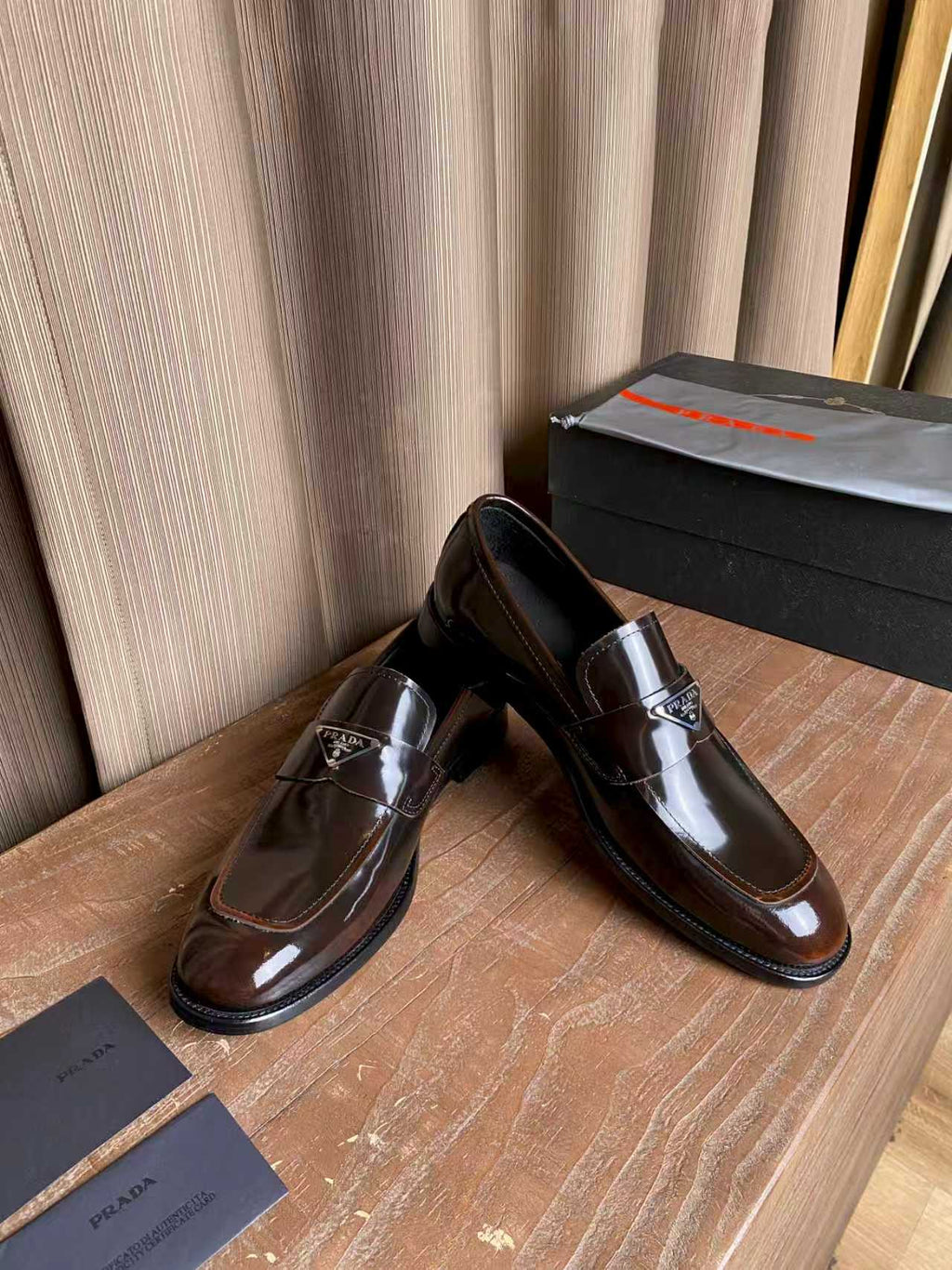 Prada unisex leather loafers, dark brown with polished vamp and logo emblem