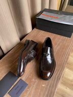 Prada unisex leather loafers, dark brown patent-like sheen with strap detail