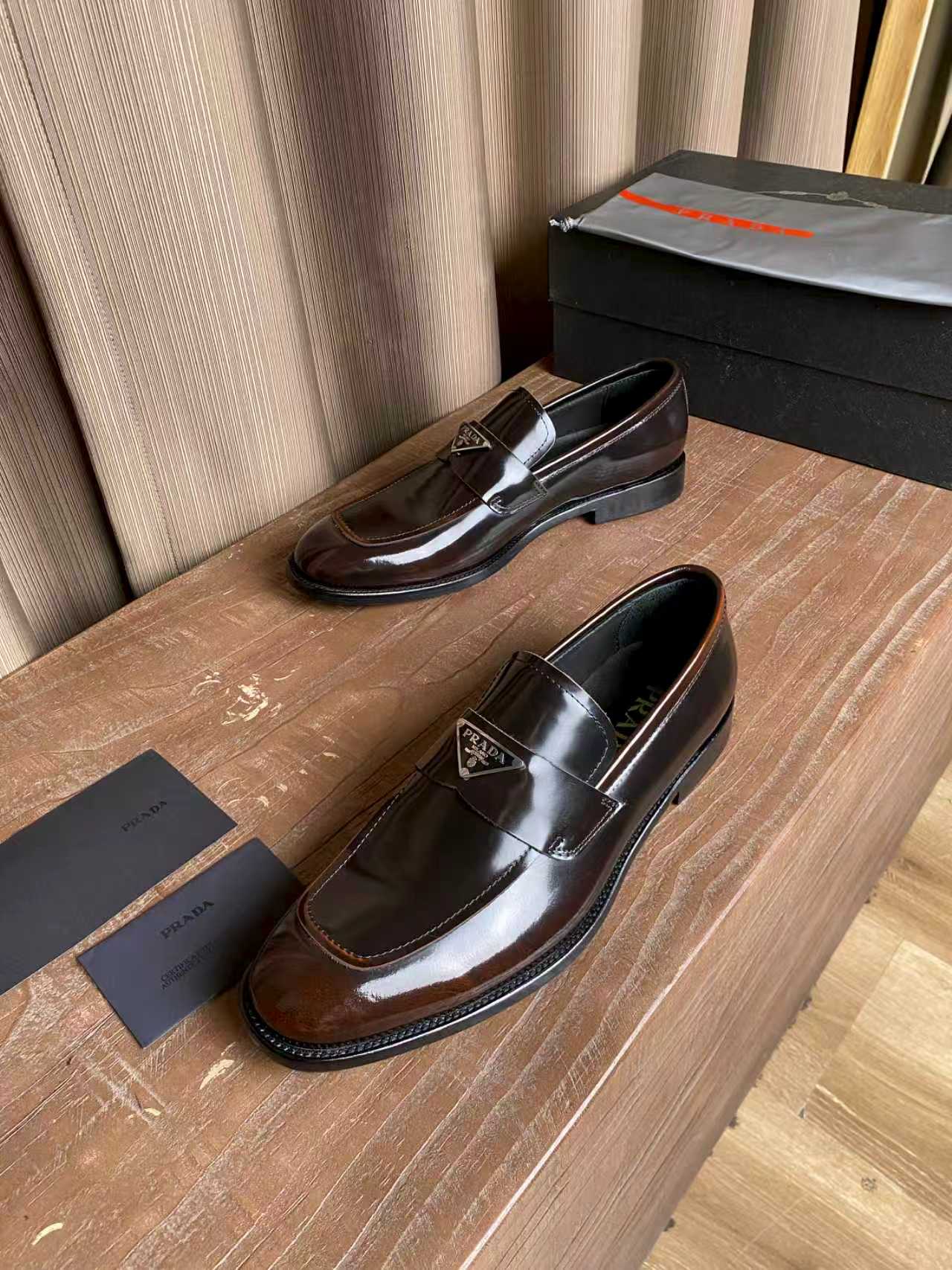 Prada unisex leather loafers, dark brown glossy with stacked heel and logo plate