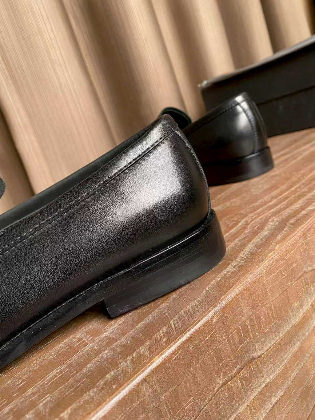 Prada black leather loafer detail, stitched vamp and low stacked heel
