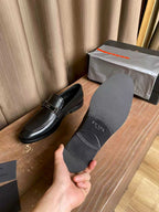 Prada unisex leather loafer with dust bag, dark black slip-on with buckle bar