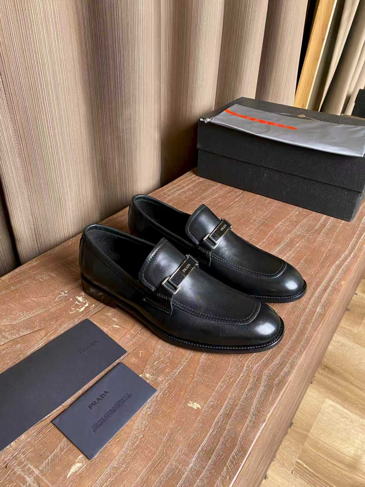 Prada unisex leather loafers, dark black with strap buckle detail