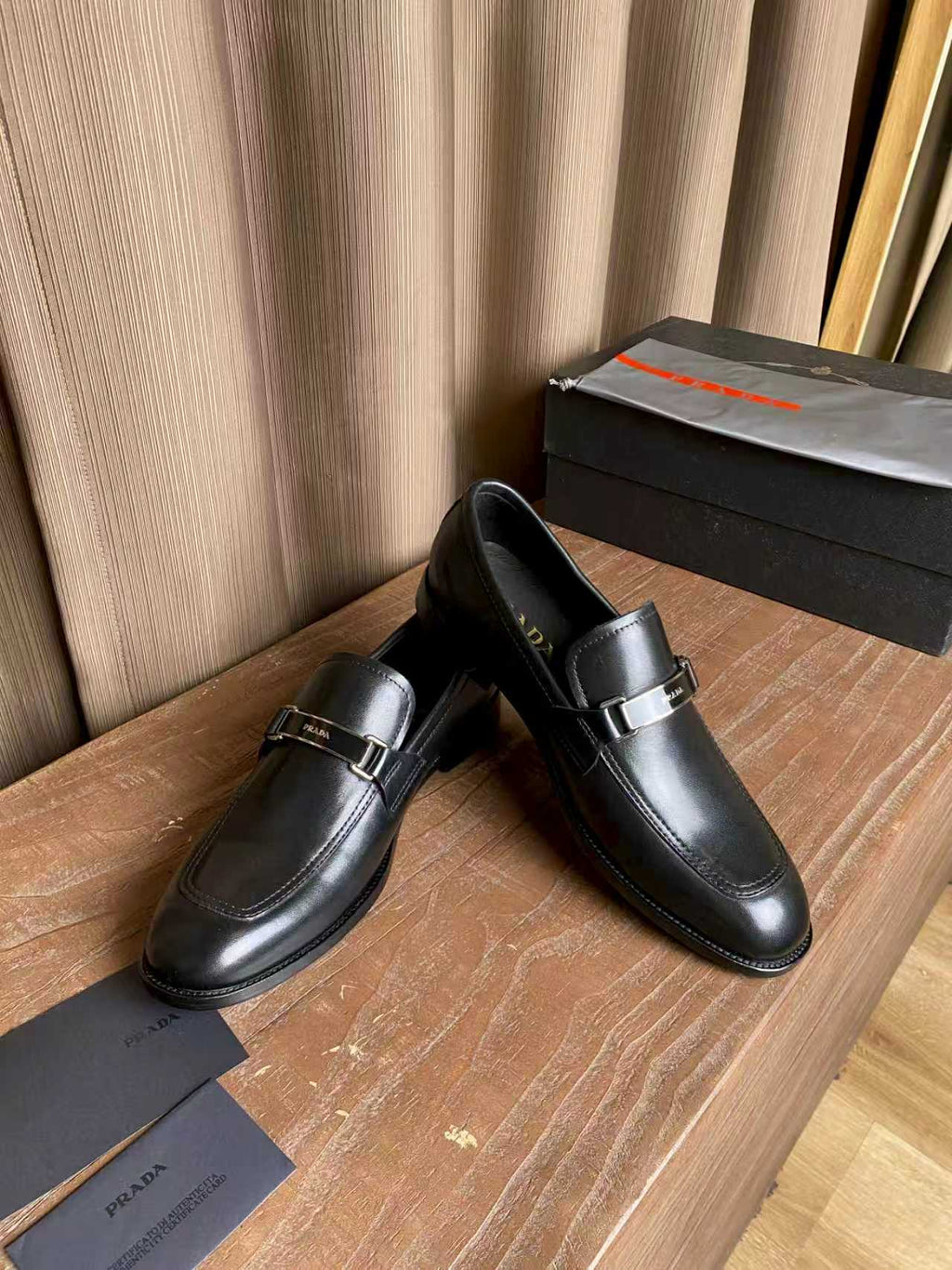 Prada unisex leather loafers, dark black slip-on with buckle hardware