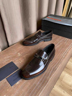 Prada unisex leather loafers, dark brown gloss with silver buckle strap, heel view