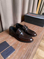 Prada unisex leather loafers, dark brown gloss side view with silver buckle