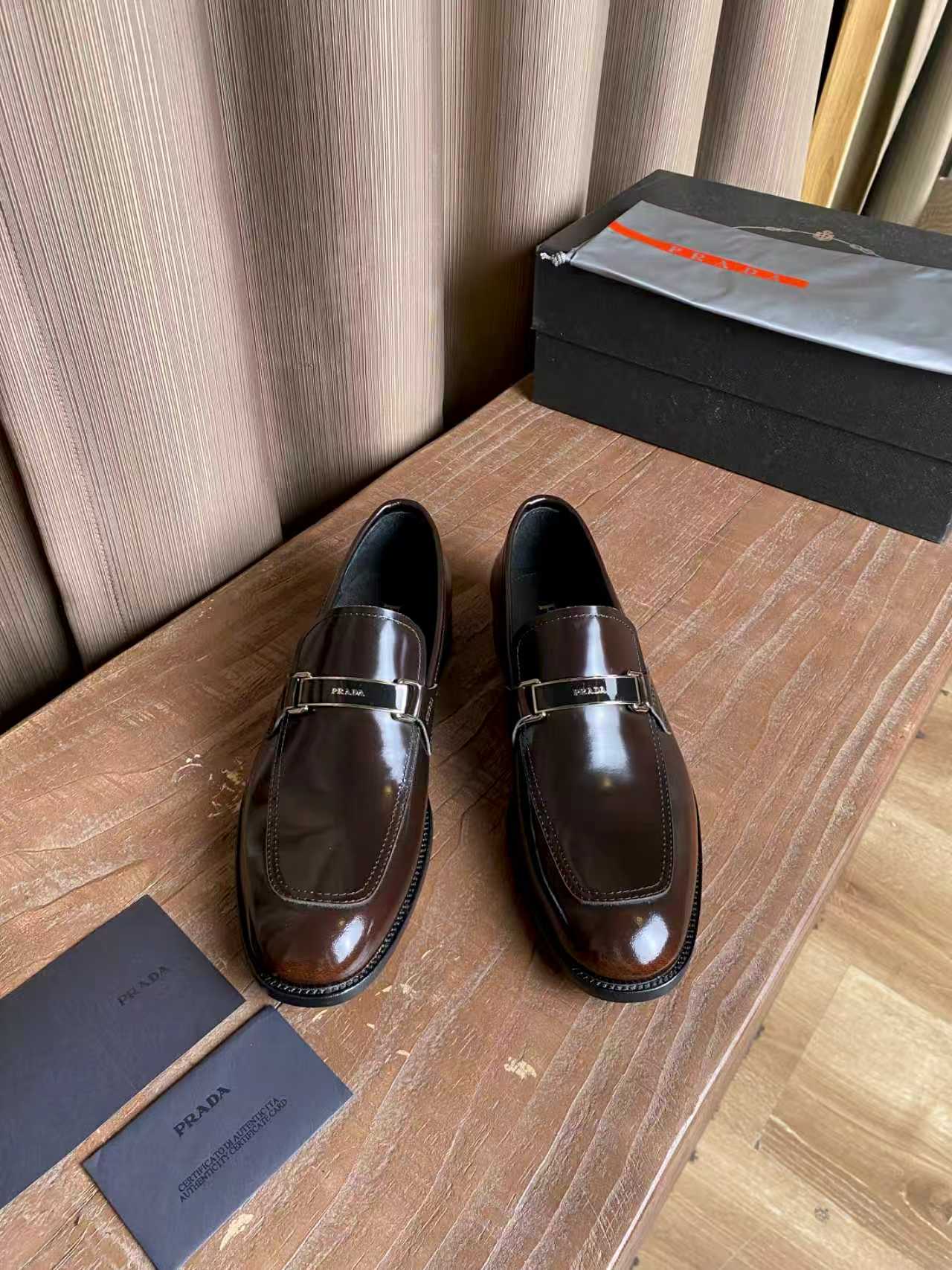 Prada unisex leather loafers, dark brown gloss with silver buckle strap