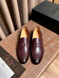 Burgundy leather loafers with Dior logo hardware, slip-on design