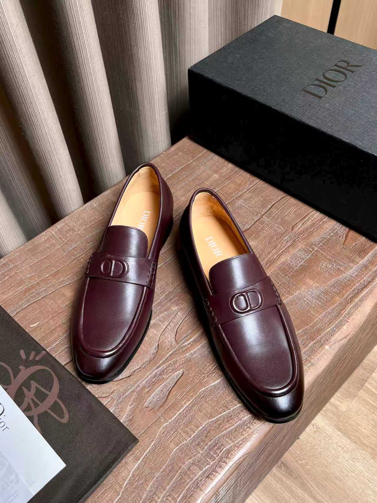 Burgundy leather slip-on loafers with front strap and D logo hardware