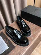 Black patent leather loafers with Dior plaque and textured rubber-look sole