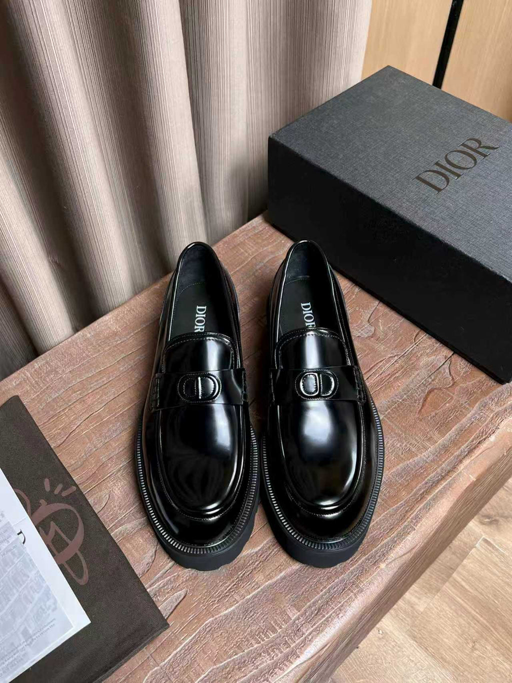 Black patent leather loafers with Dior plaque and stitched moc-toe trim