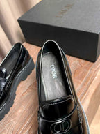 Black patent leather loafer with gray lining and Dior logo on the insole