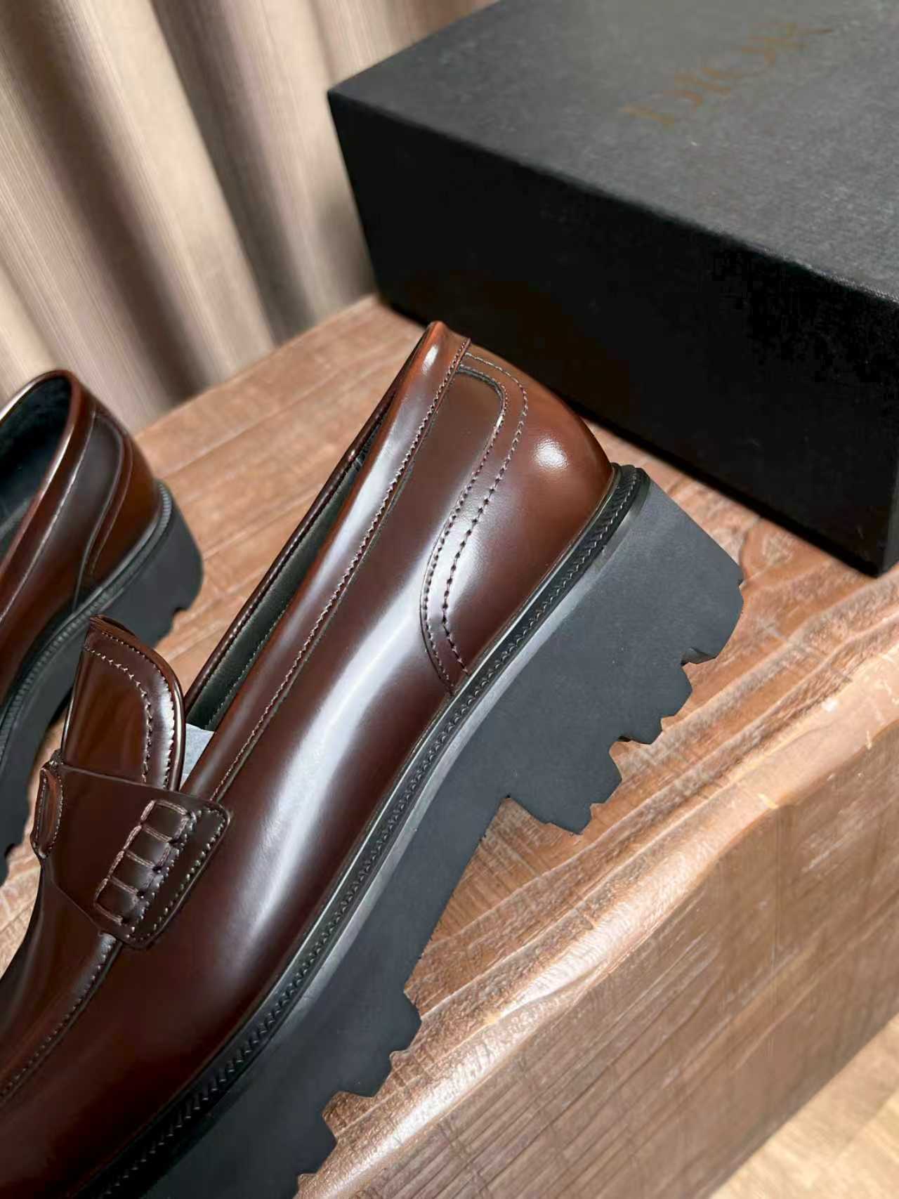 Dior unisex leather loafer, brown slip-on side view with stitched panels