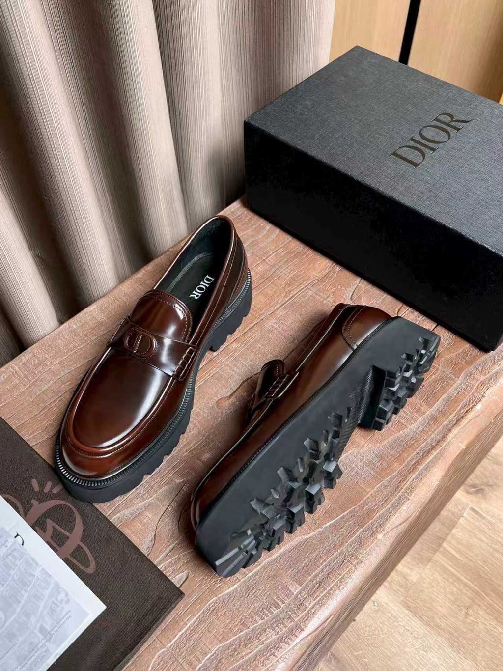 Dior unisex leather loafers with brown upper and black outsole tread
