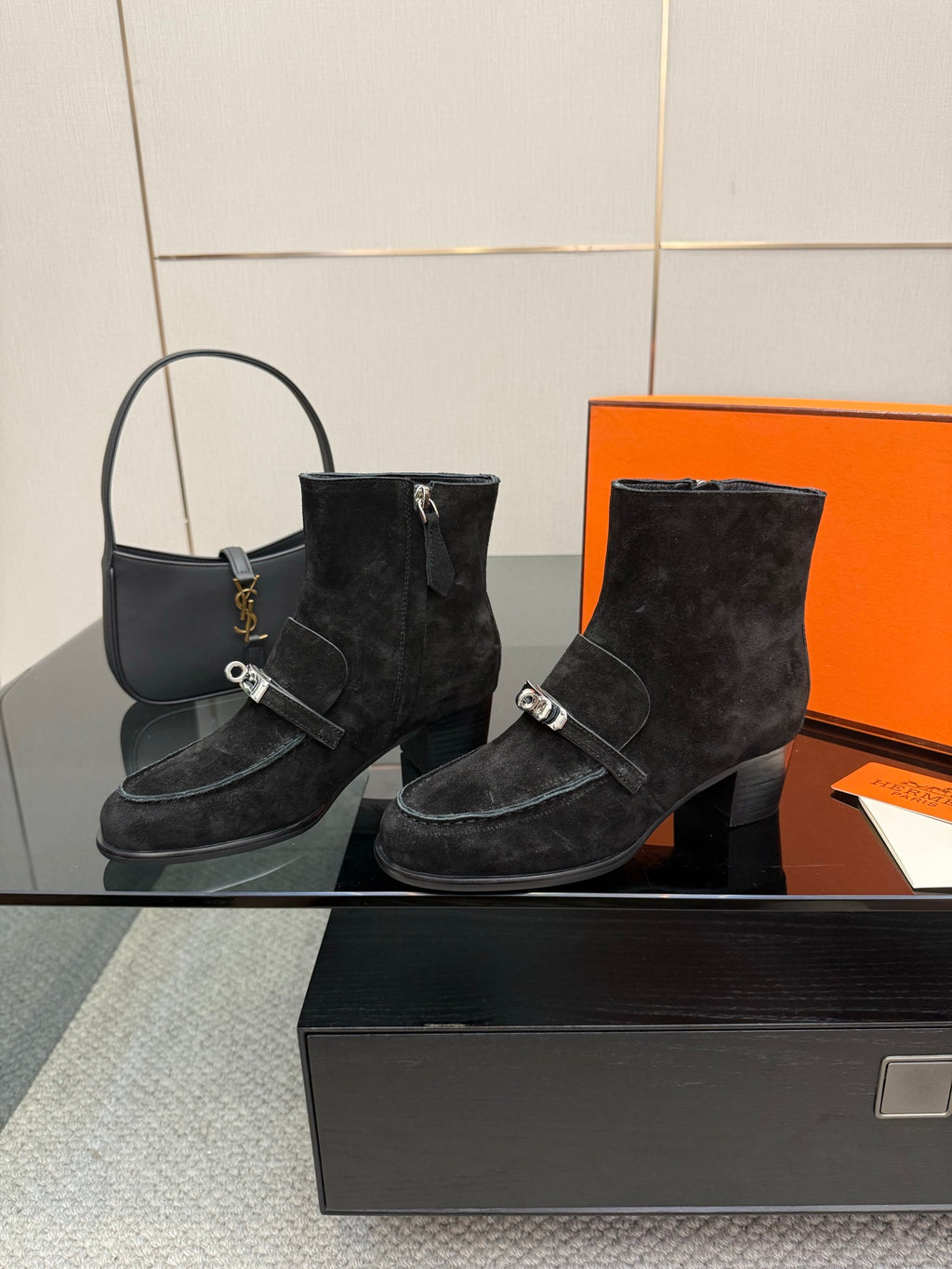 Black women’s ankle boots with buckled straps and stacked block heels