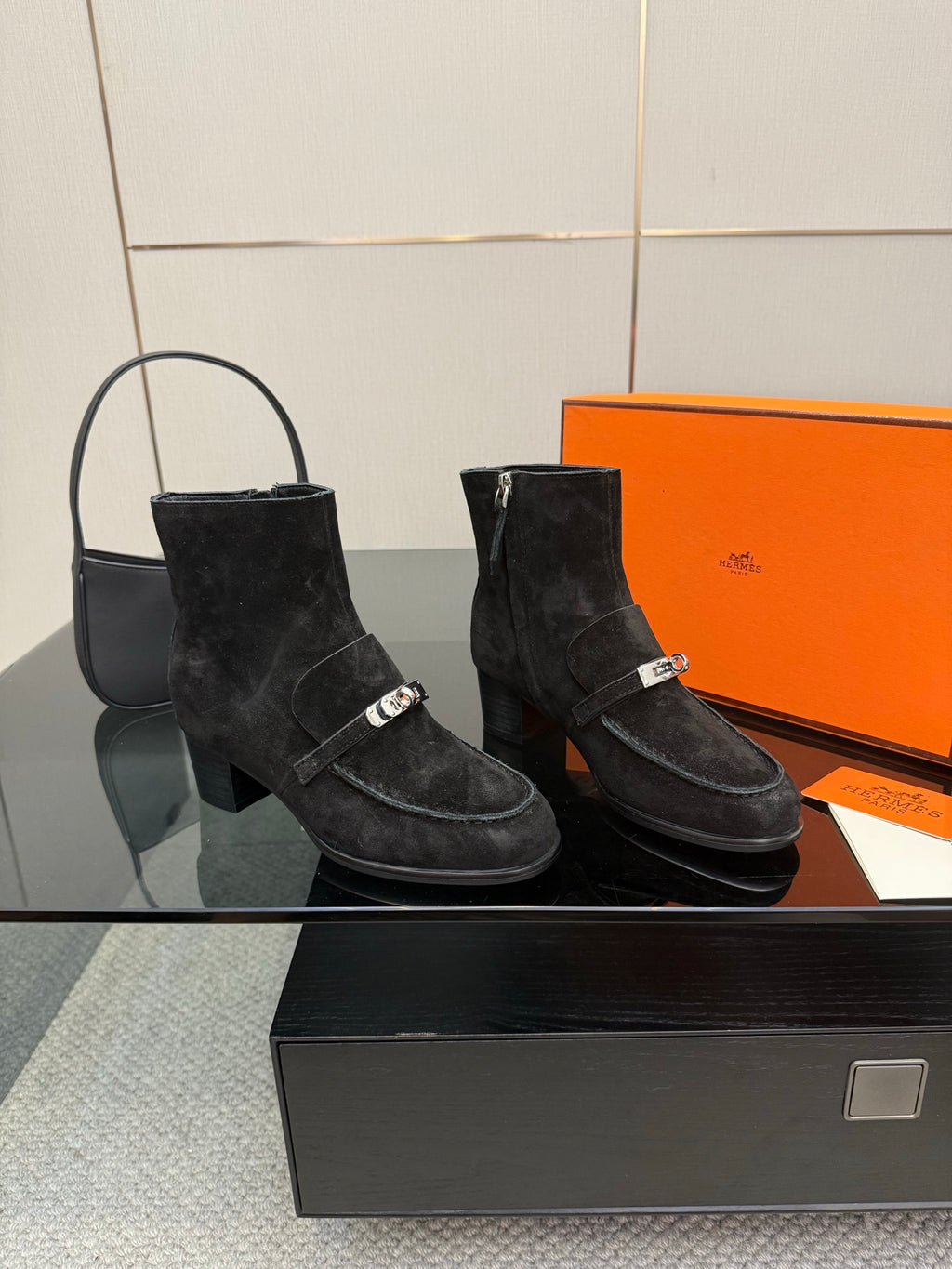 Black women’s ankle boots with side buckle details and low block heels