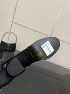 Black women’s ankle boot outsole with white barcode label