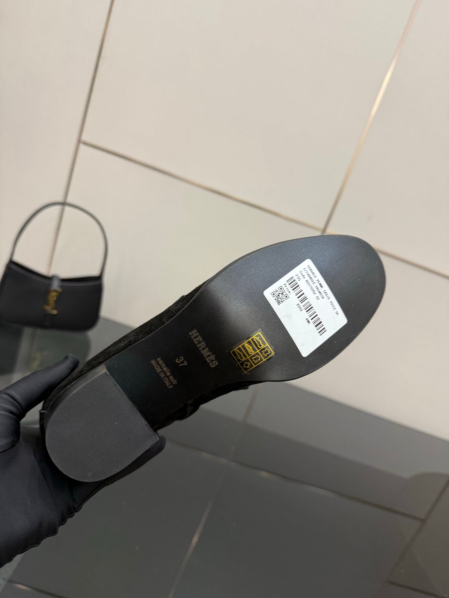 Black women’s ankle boot outsole with white barcode label
