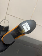 Tan suede ankle boot outsole with label and barcode, showing the bottom view.