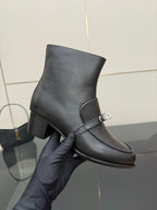 Hermes ladies black leather ankle boot on hand, silver buckle strap detail