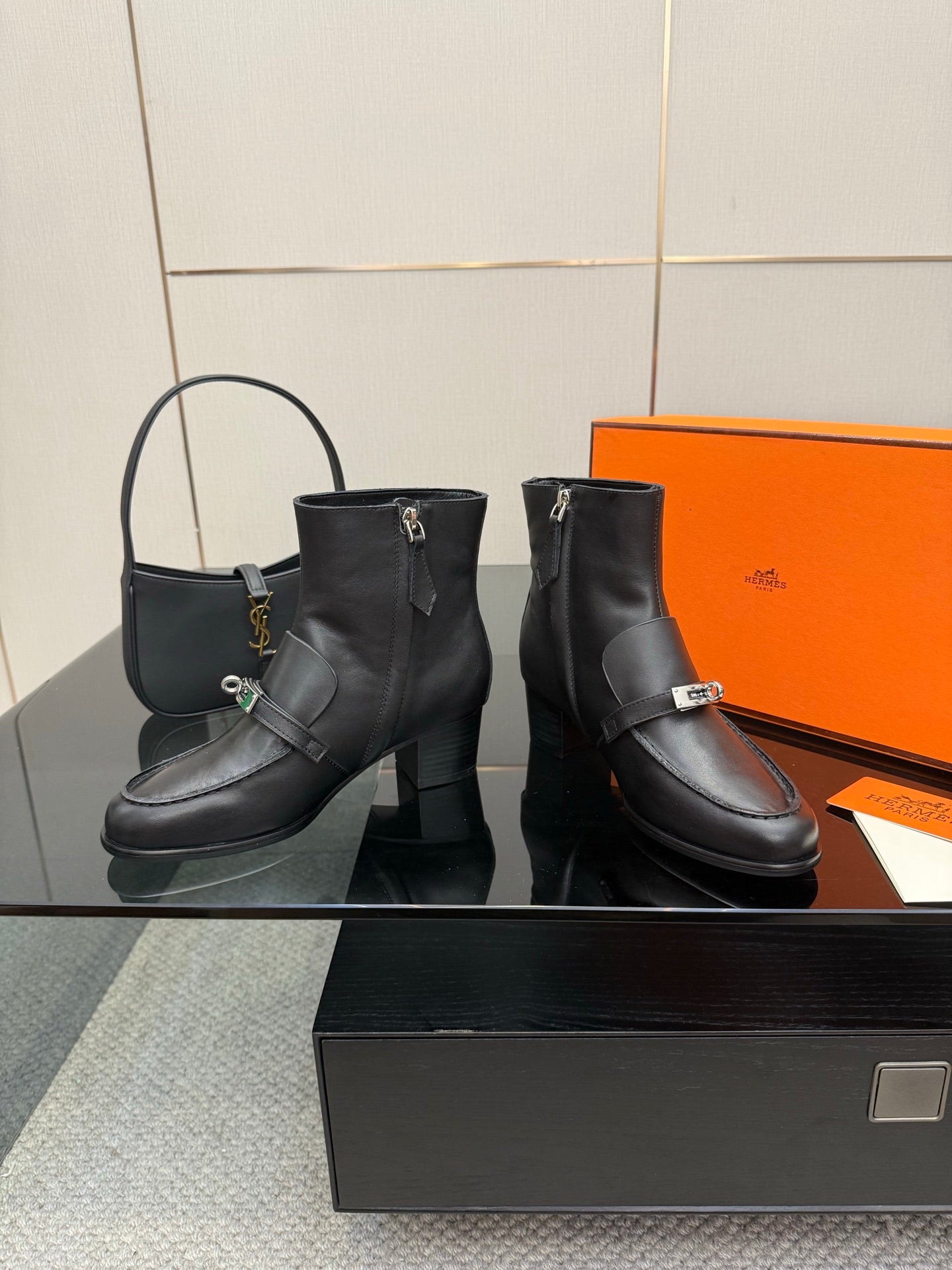 Hermes ladies black leather ankle boots with silver buckle strap and block heel, pair