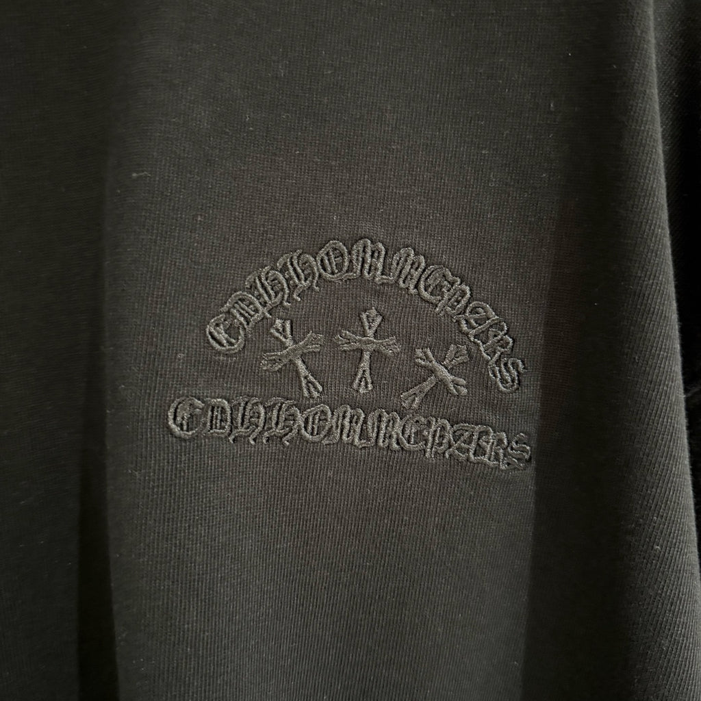 Black fabric with gray tone-on-tone logo embroidery across the chest