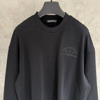 Black long-sleeve crewneck sweatshirt with ribbed collar and chest logo