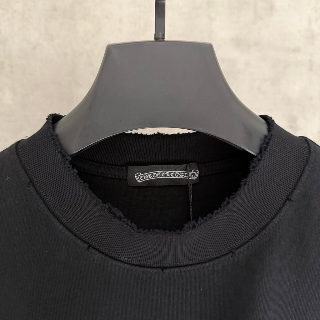 Black crewneck sweatshirt neckline with ribbed collar and inner brand label