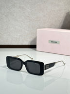 MiuMiu sunglasses with black square frames and gold-toned metal arms