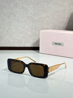 MiuMiu sunglasses with brown square frames and gold-toned metal arms