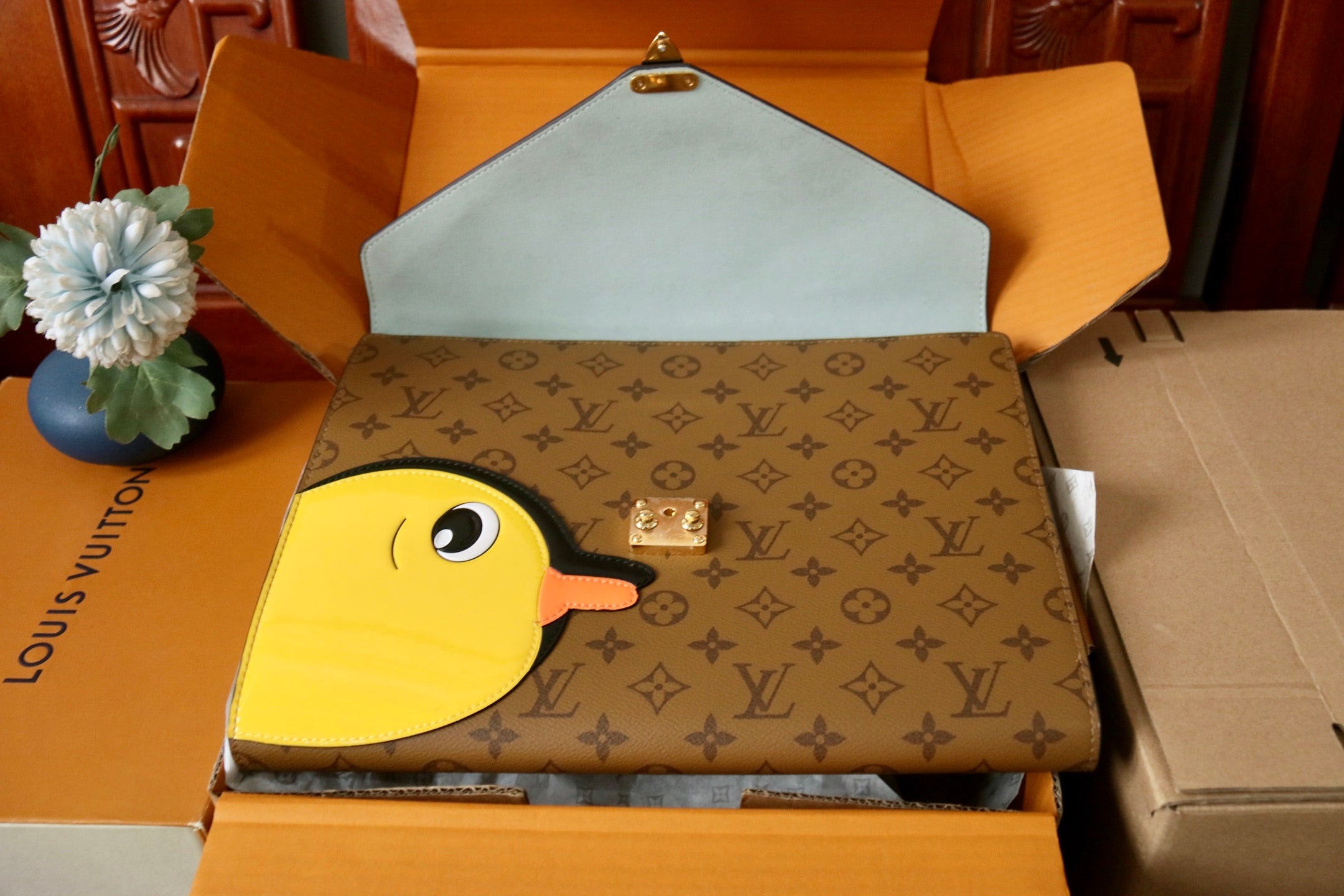 Louis Vuitton monogram bag with yellow bird applique and hinged flap