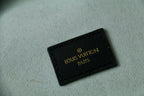 Louis Vuitton logo leather patch label on fabric
