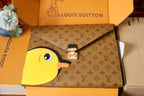 Louis Vuitton small bag with yellow bird appliqué and silver-tone lock