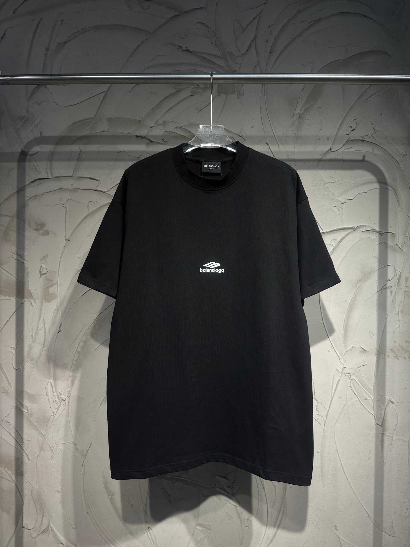 Black short-sleeve T-shirt with small Balenciaga logo on the chest