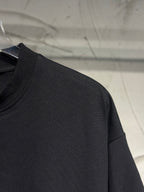 Black T-shirt sleeve and shoulder seam