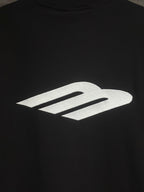 Black short-sleeve T-shirt with large white logo graphic on the chest