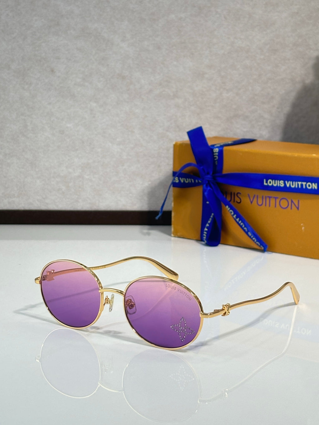 Louis Vuitton round sunglasses with gold frame and purple lenses