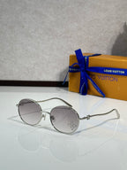 Louis Vuitton round sunglasses with silver frame and dark gray lenses