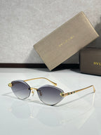 Bvlgari gold-tone sunglasses with dark gray gradient lenses and jeweled temple tips
