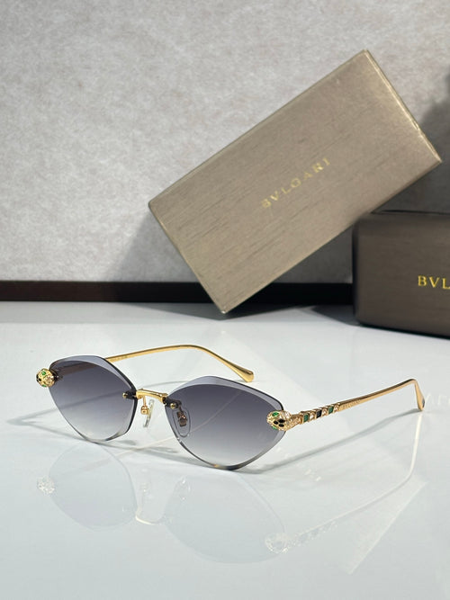 Bvlgari gold-tone sunglasses with dark gray gradient lenses and jeweled temple tips