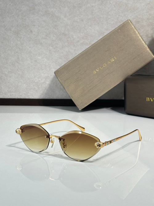 Bvlgari gold-tone sunglasses with amber gradient lenses and jeweled temple tips