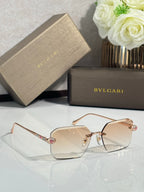 Bvlgari glasses, gold metal rectangular frames with clear lenses and pink jeweled temple accents