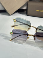 Bvlgari glasses, close view of gold metal rectangular frames with blue tinted lenses