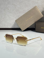 Bvlgari glasses, gold metal rectangular frames with warm brown tinted lenses and jeweled temples
